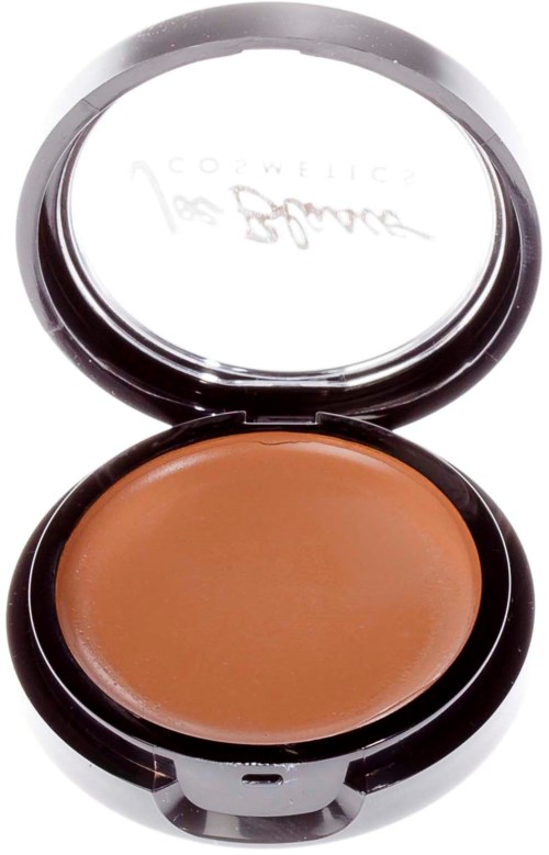A compact with brown pressed powder and a mirror inside the lid.