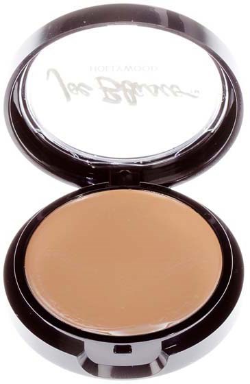 A compact makeup case with beige powder inside and a clear lid showing the brand logo.