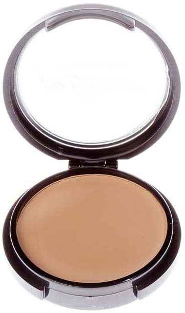 A compact with a mirror open, showing beige makeup product inside.