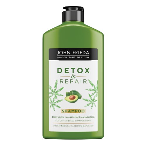 Green shampoo bottle with labels showing avocado, cannabis leaves, and text about detox and repair.