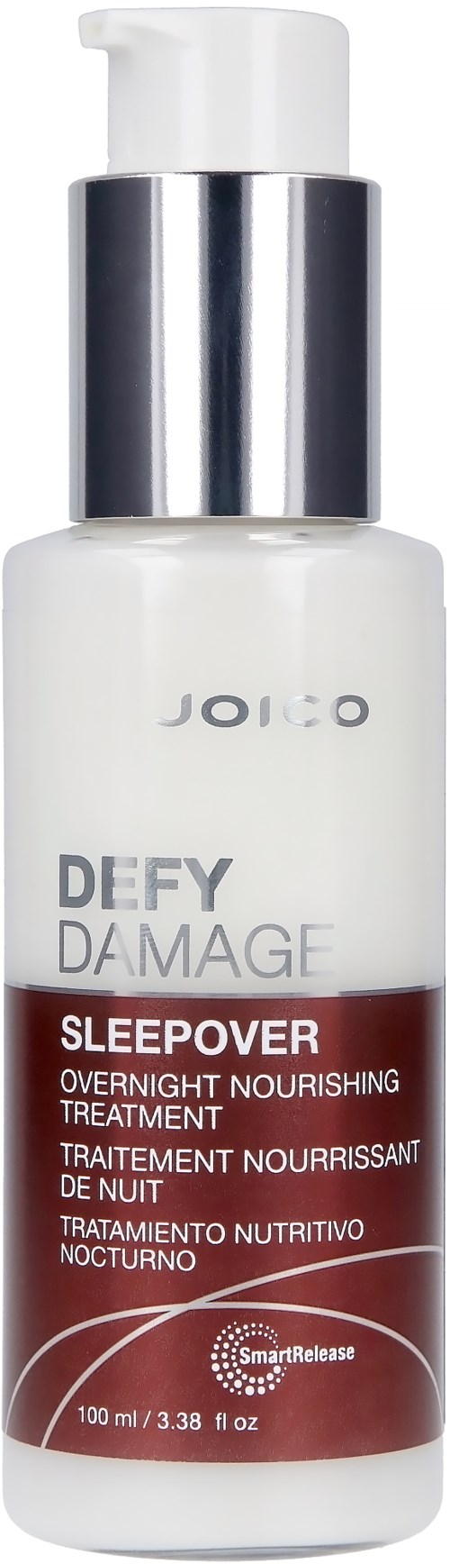 En vit flaska med silverlock, märkt 'Joico Defy Damage Sleepover' för nattbehandling.