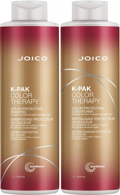 Two bottles of Joico K-Pak Color Therapy shampoo and conditioner with beige and pink packaging and white caps.