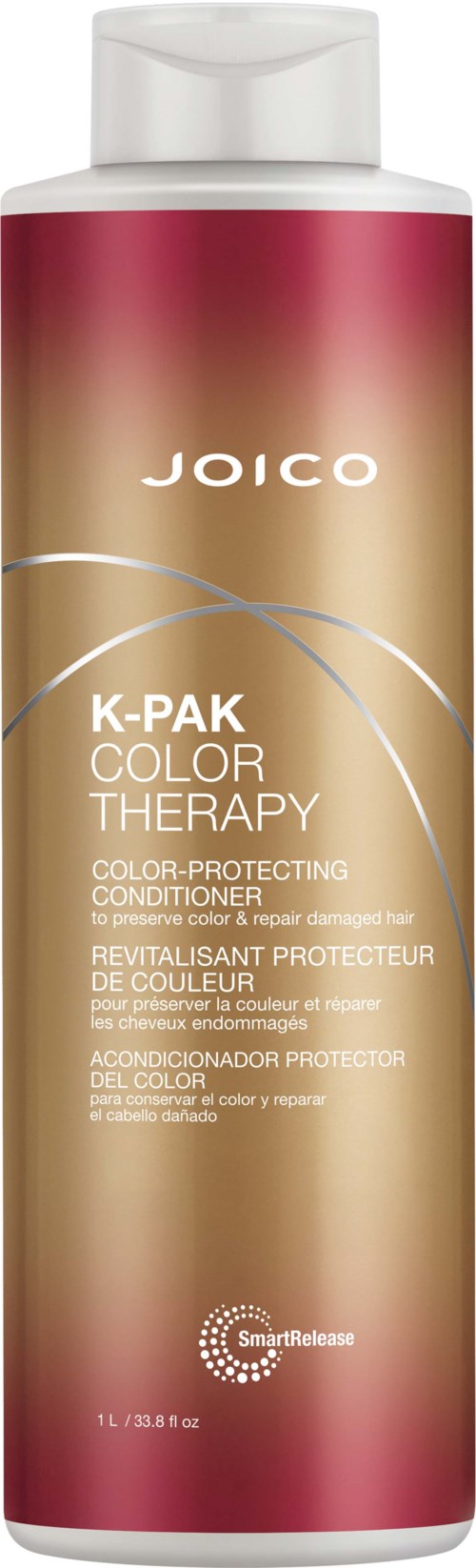 A tall, pink and gold bottle of Joico K-Pak Color Therapy conditioner. The label mentions color protection.