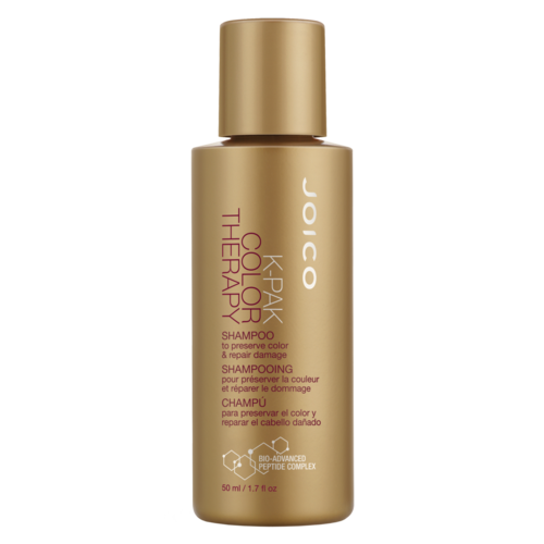 Guldfärgad flaska med Joico K-PAK Color Therapy-Schampo för färgbevarande och skadereparation.