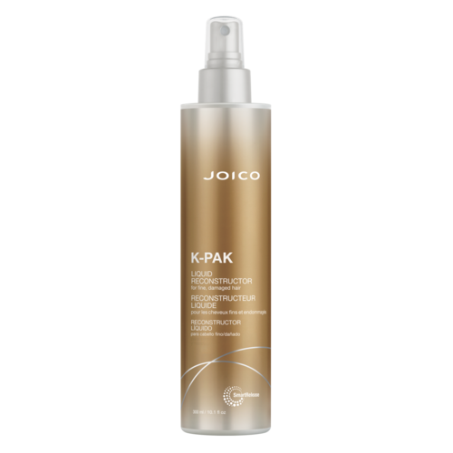 A gold-colored spray bottle labeled JOICO K-Pak Liquid Reconstructor for damaged hair.