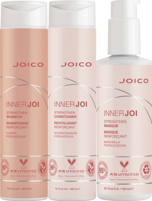 Three hair care bottles labeled 'Inner Joi', with shampoo, conditioner, and mask in light pink and white colors.