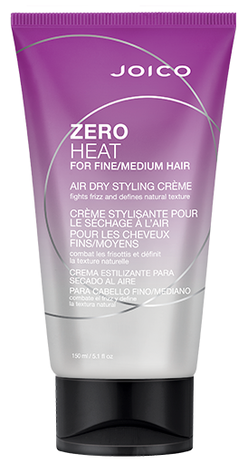 En lila tub med Joico Zero Heat stylingkräm för fint och medelstort hår, med svart lock.