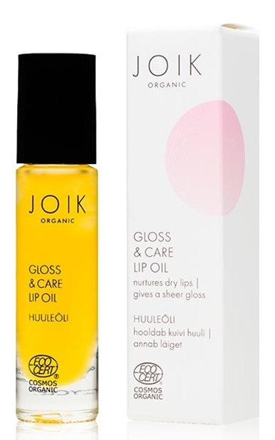 En gul läppolja flaska med svart lock och en vit förpackning märkt "Joik Organic Gloss & Care Lip Oil."