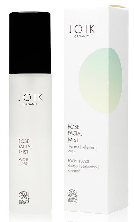 En vit flaska av Joik Rose Facial Mist bredvid dess box, som har en ljusgrön design.