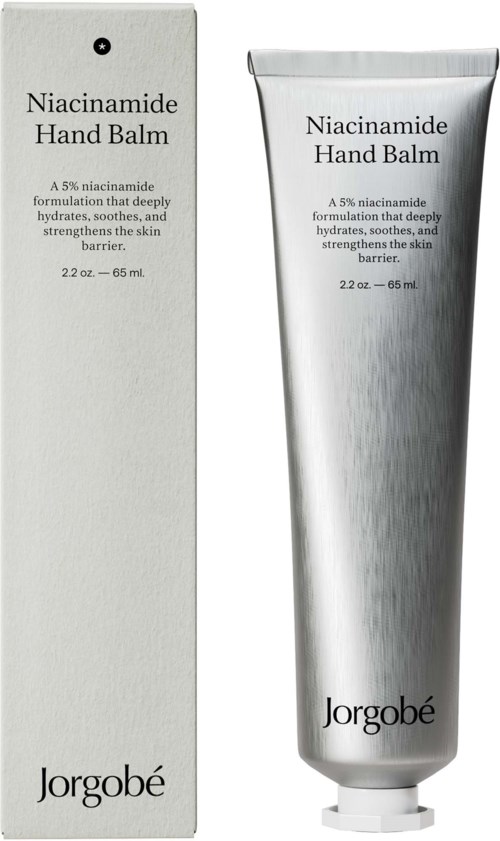 Hopea torvi ja vastaava laatikko, joissa musta teksti Niacinamide Hand Balm Jorgobé.