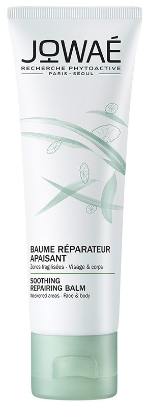 En vit tub med gröna detaljer, märkt Jowae lugnande reparerande balm för ansikte och kropp.