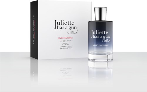 A perfume bottle and box with the name "Juliette has a gun." The bottle is dark blue with a silver cap.