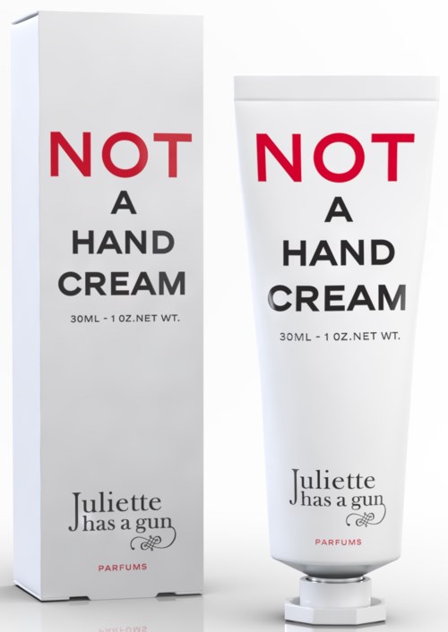 En ask och tub handkräm med roliga etiketter, inklusive frasen "NOT A HAND CREAM" och ett namn Juliette.
