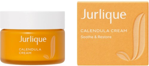 En burk och ett förpackning av Jurlique Calendula Creme, gult färg, med vit lock och text.