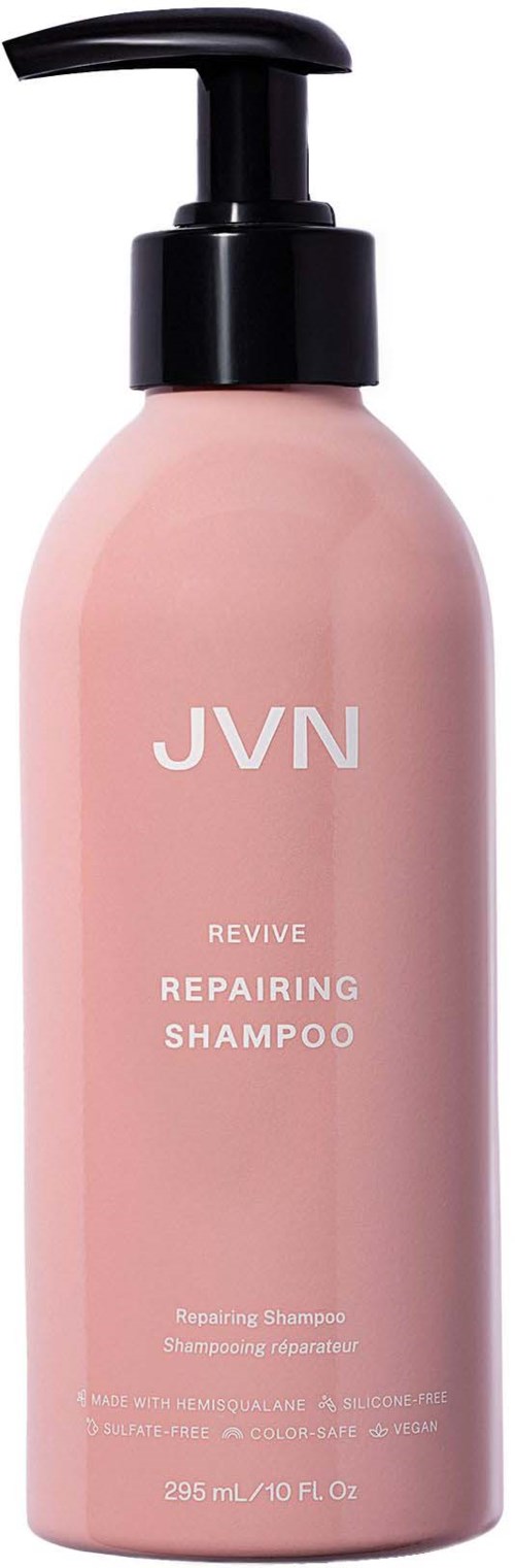 Pink schampoflaska med svart pump märkt JVN Revive Repairing Shampoo.