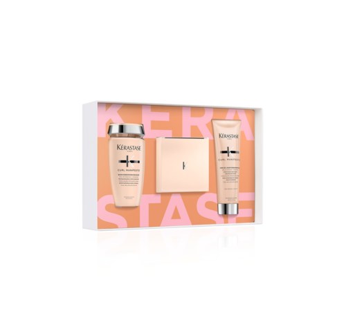 A skincare set with a shampoo, conditioner, and soap in a pink box with large pink letters.