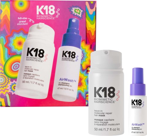 Pakkaus K18 Biometric Hair Science -tuotteita, mukaan lukien hiusnaamiota ja kuiva shampoota.