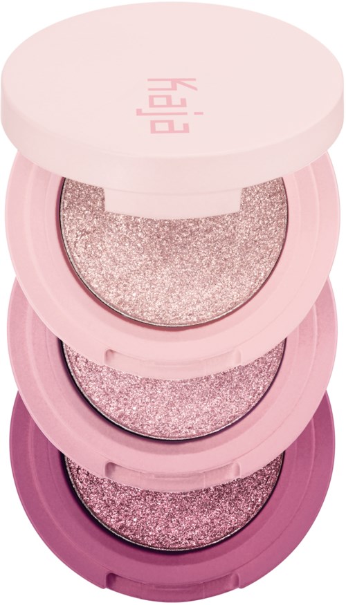 Tre stablede rosa og lilla øjenskyggepaletter med glitrende nuancer indeni.