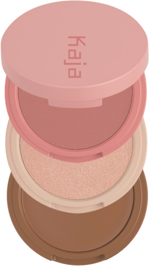 Three round makeup sponges stacked, from pink to beige to brown, in containers with lids.