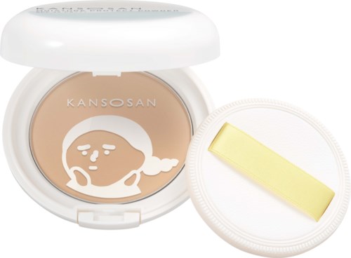 Een cushion met een schattig gezichtsontwerp en een gele applicator, in een witte ronde container. KANSAN-merk.