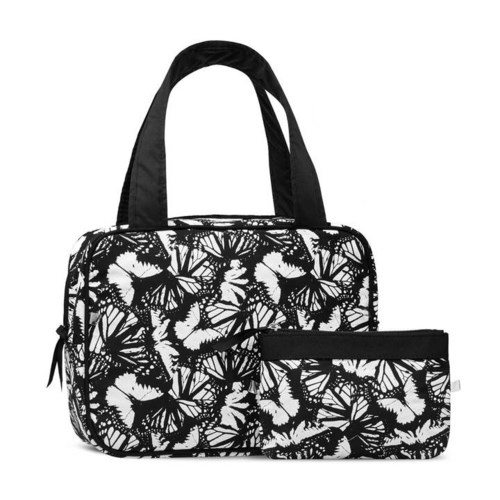 En svartvit väska med fjärilsmodell och en mindre matchande fodral.
