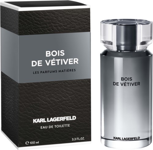 En parfymflaska med svart och silver design, kallad Bois de Vêtiver av Karl Lagerfeld, bredvid dess förpackning.