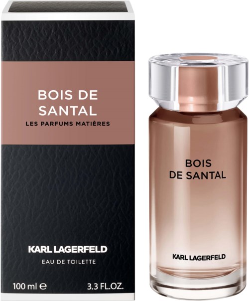 En parfymflaska och låda märkt 'Bois de Santal' av Karl Lagerfeld, med en enkel, elegant design och ljusrosa färg.