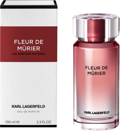 A perfume bottle and box labeled 'Fleur de Mûrier' by Karl Lagerfeld, in red and white colors.