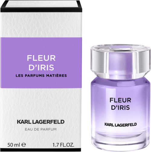 A purple perfume bottle with a silver cap next to a white and purple box. The box and bottle have the same text.