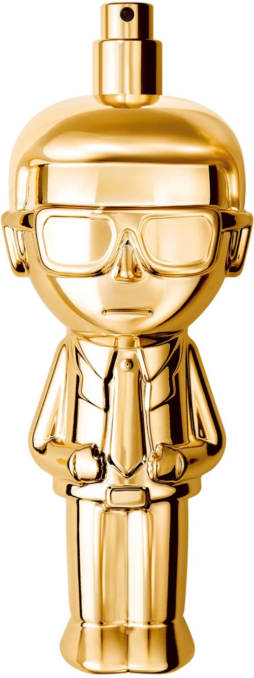 Eine goldene Parfummarke in Form einer Person mit Brille und Anzug, steht gerade mit Händen in den Taschen.