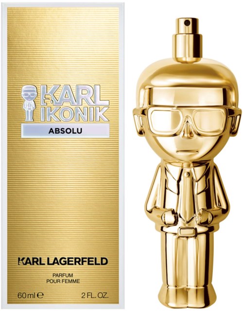 Eine goldene Parfümflasche in Form eines modischen Mannes mit Brille neben einer goldenen Verpackung mit Text.