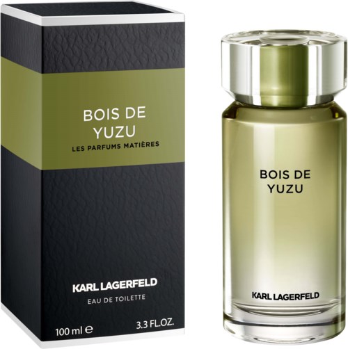 A perfume bottle and box labeled 'Bois de Yuzu' by Karl Lagerfeld, sleek design with black and green colors.