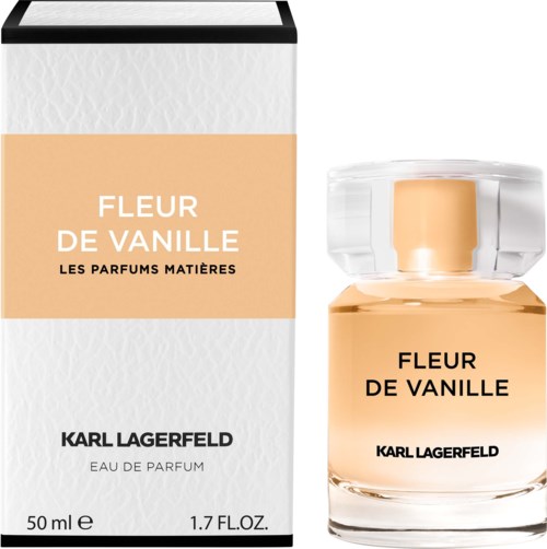En vit och beige parfymkartong med Karl Lagerfeld-märke och en tydlig glasflaska med Fleur de Vanille-parfym.