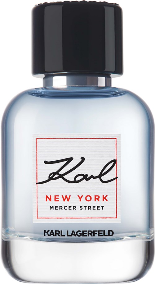 En klar parfyllflaska med svart caps, etiketten säger "Karl New York Mercer Street."