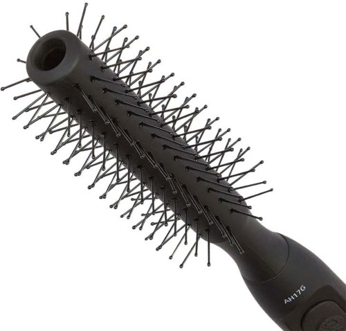 A heated hairbrush with many small pins for styling hair.