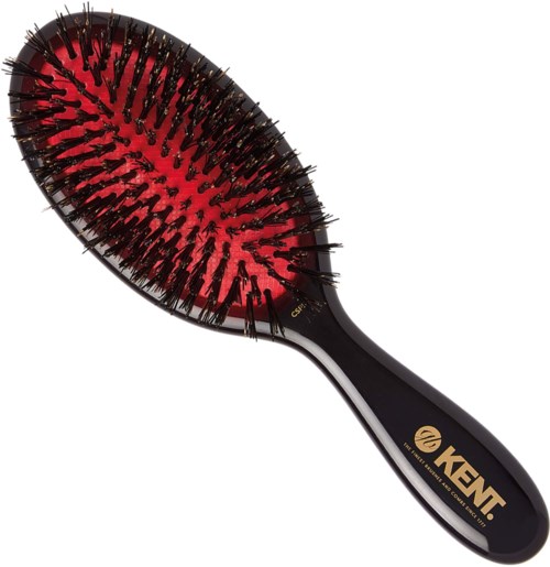 A black hairbrush with a red padded base and black bristles, labeled KENT for hair grooming.