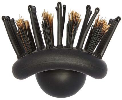 A black brush holder with many small brushes sticking out, some with brown bristles, arranged in a circle.