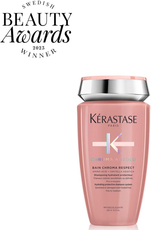 A pink shampoo bottle with a silver cap, labeled Kerastase Chroma Absolu, awarded at Swedish Beauty Awards 2023.