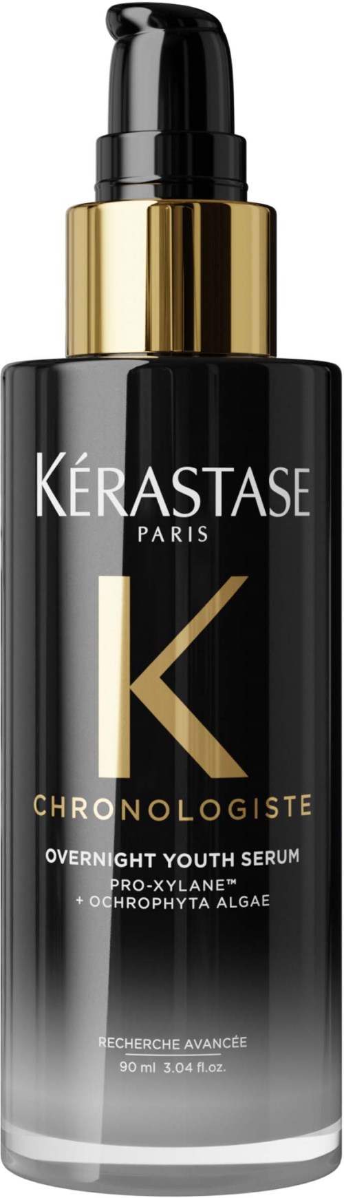 Eine schwarze und goldene Flasche mit Kerastase Chronologiste Youth Serum mit Pumpkopf.