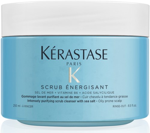 A blue jar of Kérastase scrub for oily scalp, with white cap and text on the label.
