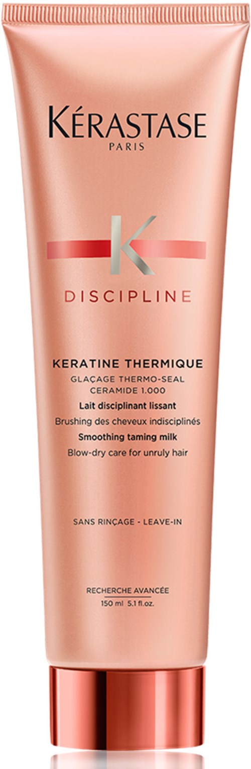 En rosa hårvårdsrör med guldkork, märkt 'Kérastase Discipline Keratin Thermique' för oroligt hår.
