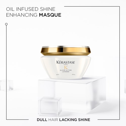 Dette er en hvit krukke med gullteip for hårmaske, merket Kérastase. Den lover at matt hår mangler glans.