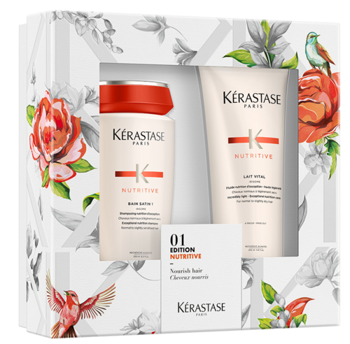 A hair care set with shampoo, conditioner, and a small booklet, all in a floral box with colorful bird and flower illustrations.