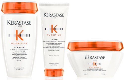 Tre hårvårdsprodukter från Kérastase, inklusive schampon och en mask, med orange och vit förpackning.