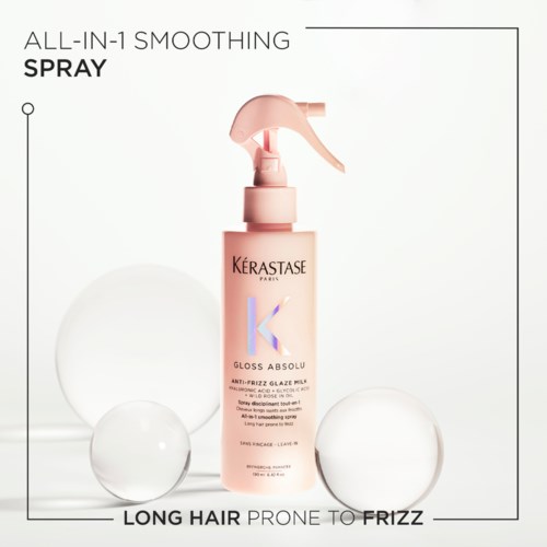 Kérastase Gloss Absolu spray mleczko wygładzające anty-frizz dla długich, puszących się włosów, z białymi kulami na białym tle.