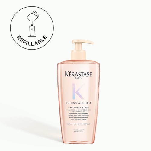 Rosa flaska med pump märkt Kérastase och 'GLOSS ABSOLU'. Påfyllningsikonen ingår. Passar för hårvård.
