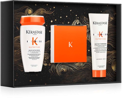 This is a set of hair care products with a black and gold starry background, including shampoo, conditioner, and a box.
