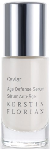 Valkoinen pullo kiiltävällä hopeakorkilla, merkintä 'Caviar Age-Defense Serum' valmistajalta Kerstin Florian.
