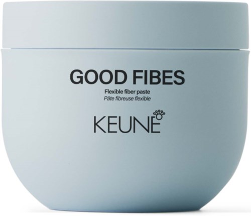 Ein runder, hellblauer Behälter mit weißem Deckel, beschriftet mit 'GOOD FIBES' und 'KEUNE' für Haarprodukt.