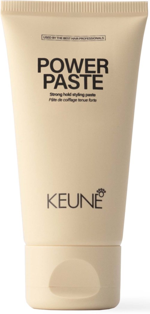 Eine weiße Tube mit der Aufschrift 'Power Paste' von Keune für starken Halt, steht aufrecht.
